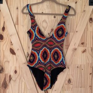 low cut “trippy” one piece bathing suit